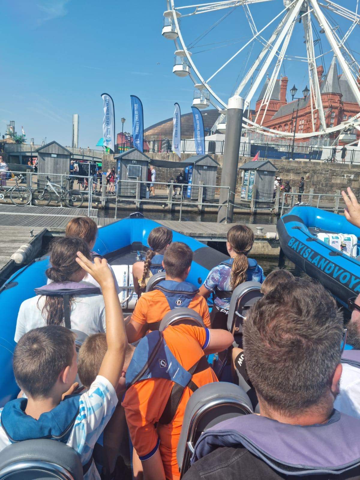 Children onboard a boat tied up on a pontoon at Cardiff Bay ready for a Children's Party trip.
